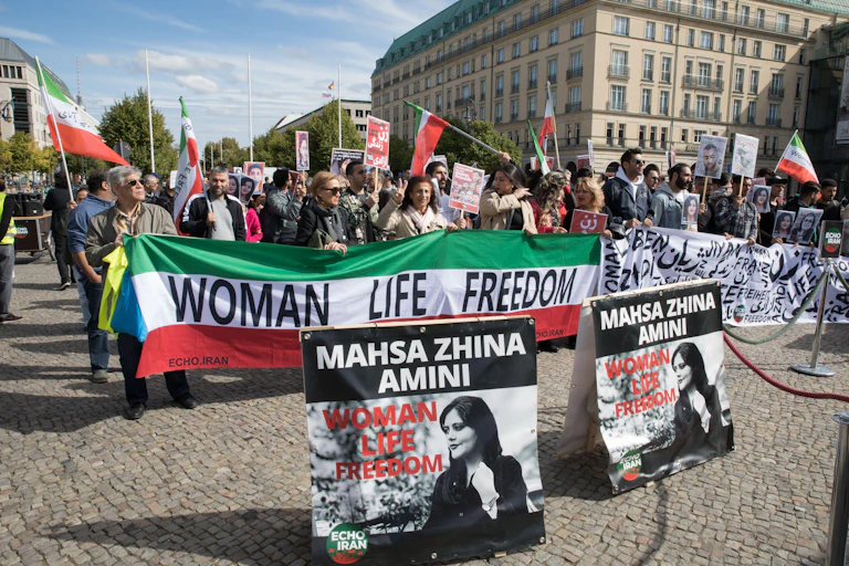 A banner saying: women, life and freedom at a protest in Berlin.