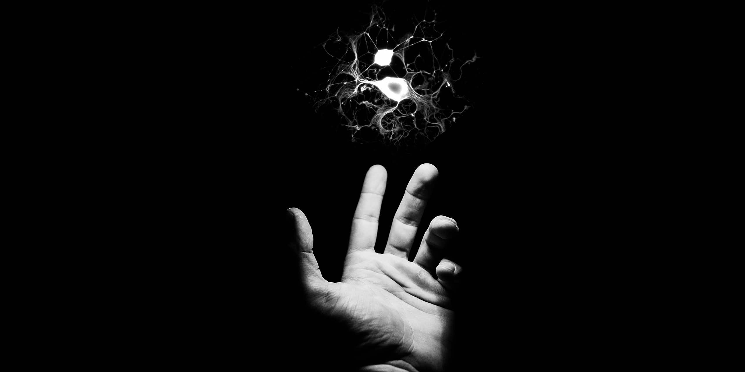 Illustration of outstretched hand reaching for a floating neuron