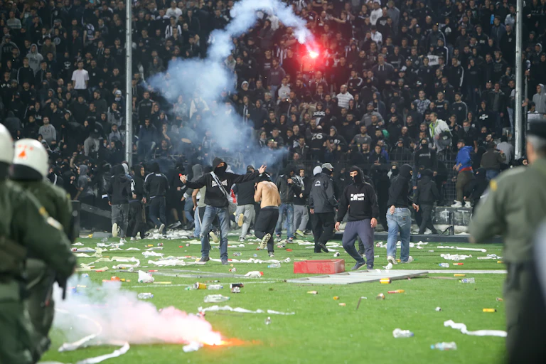 Fans and police fight during a Greek soccer game