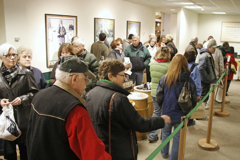 Shoppers dressed for cold weather line up at a big store