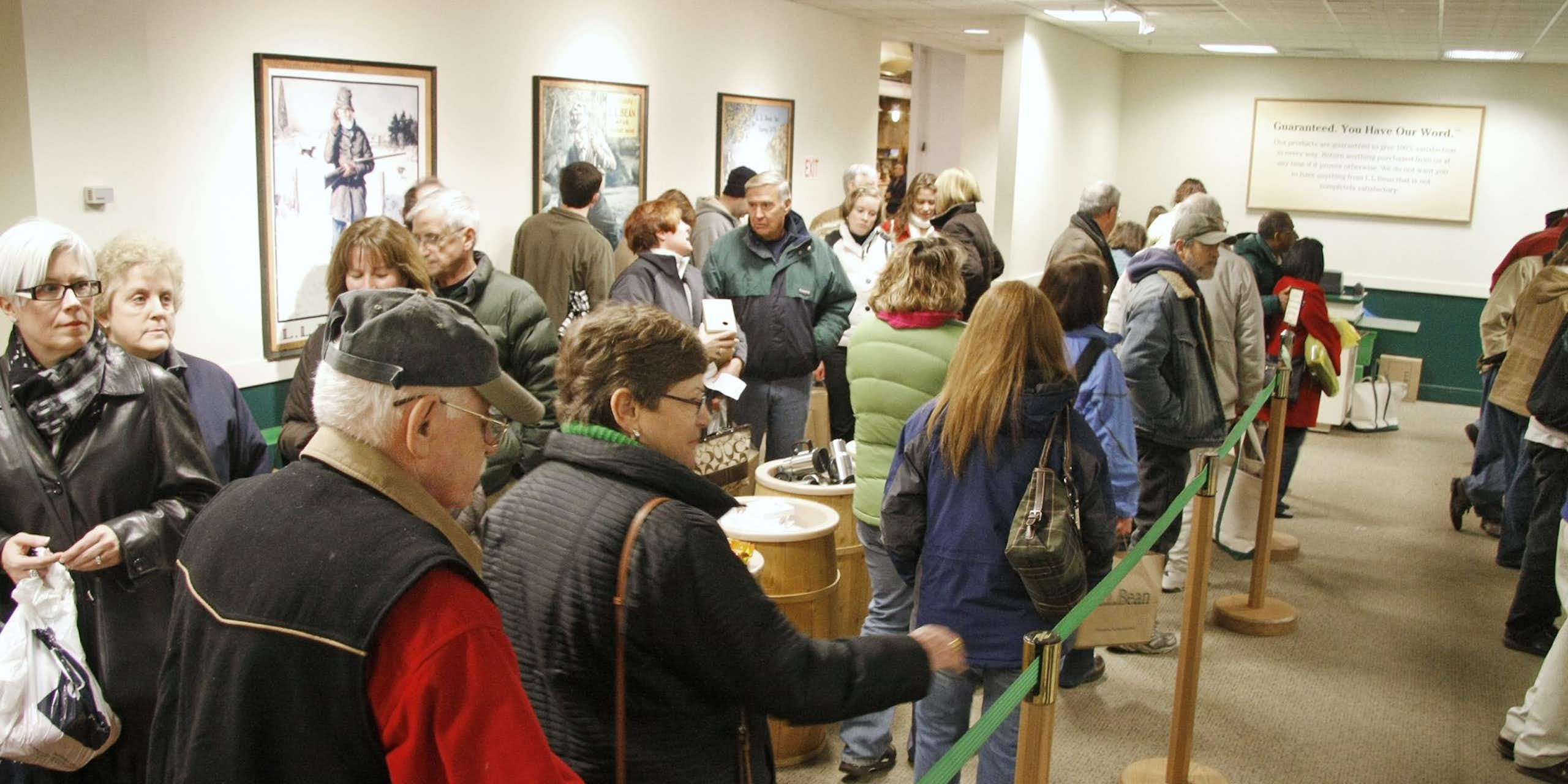 Shoppers dressed for cold weather line up at a big store