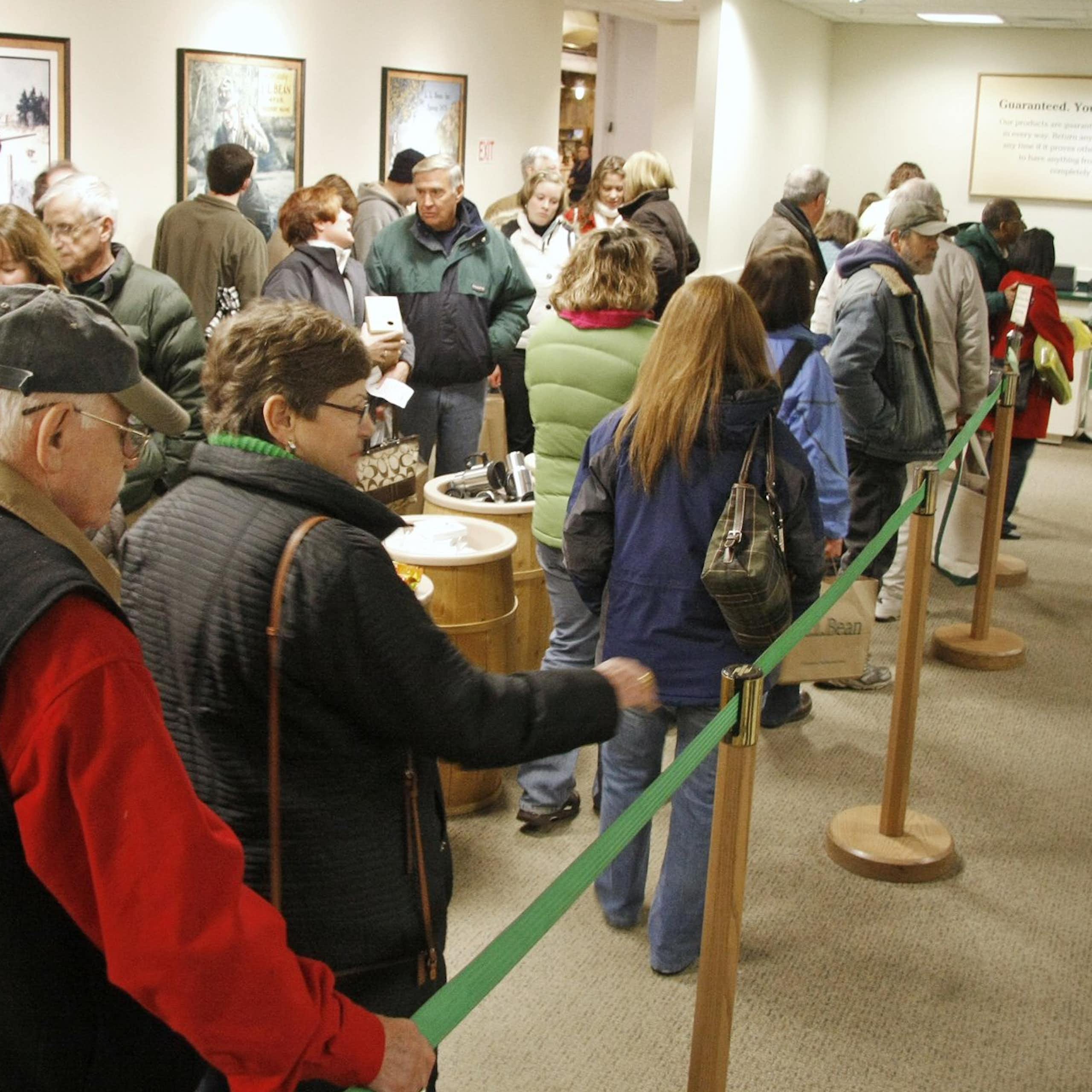 Shoppers dressed for cold weather line up at a big store