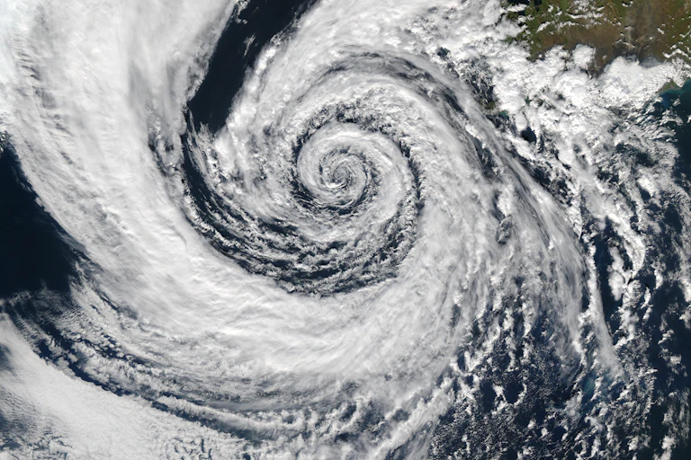 Satellite photo showing a swirling spiral of cloud.