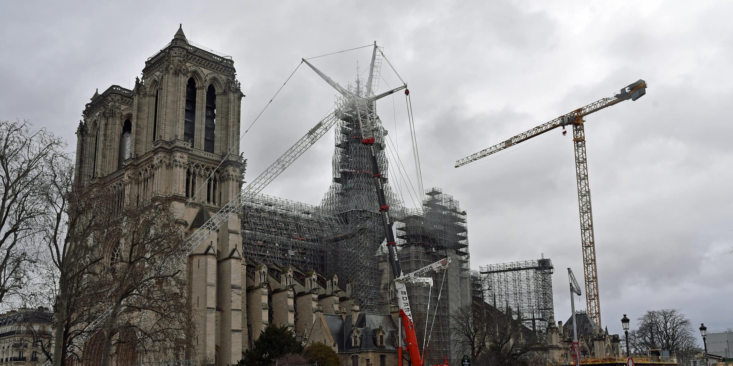 A view of Notre Dame cathedral in Paris from the left bank on an overcast day.
