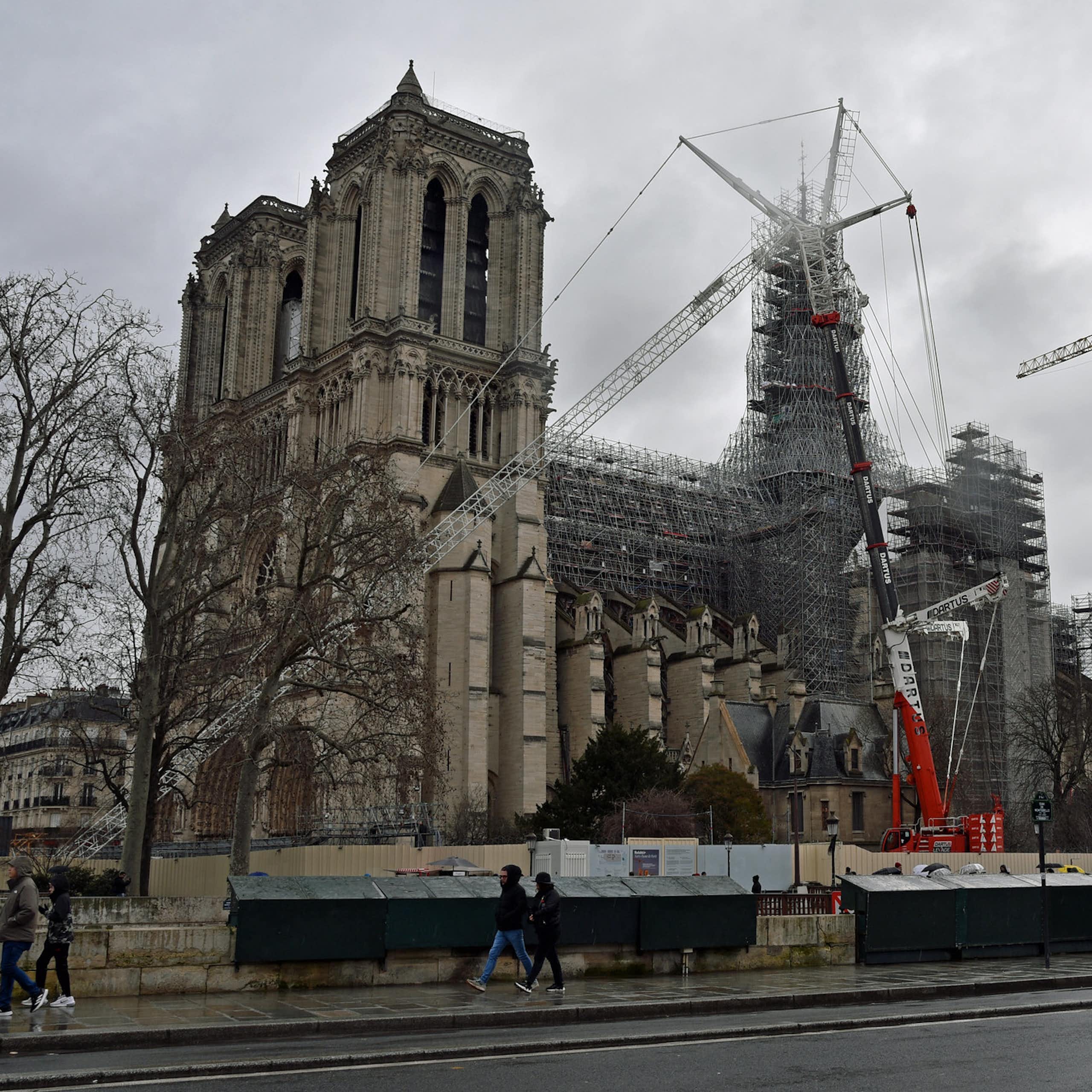 A view of Notre Dame cathedral in Paris from the left bank on an overcast day.