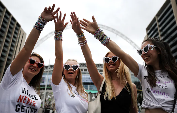 a group girls showing off bracelets