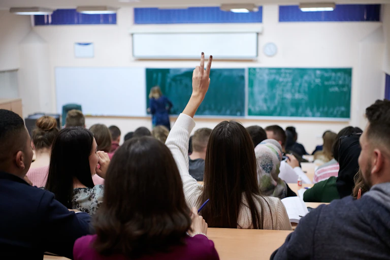 A crowded lecture hall seen from the back