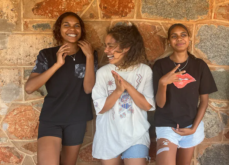 three simling young Indigenous women