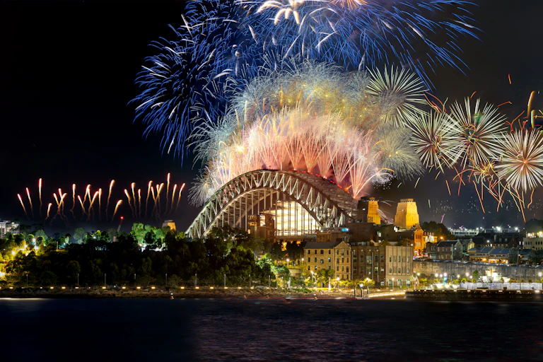 Fireworks explode above the Sydney Harbour Bridge.