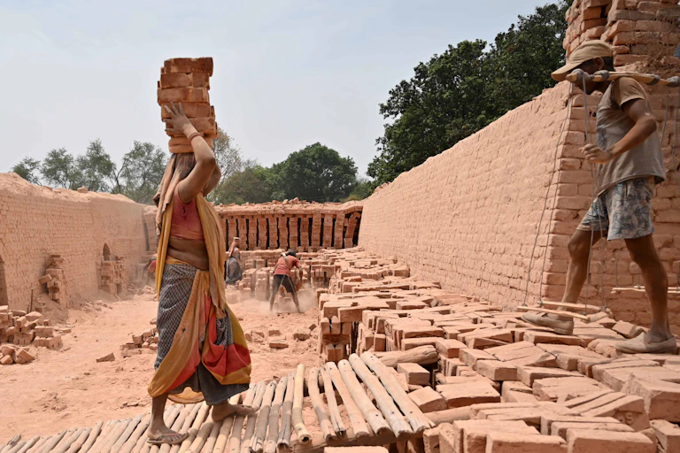 Workers at a brick factory in India.