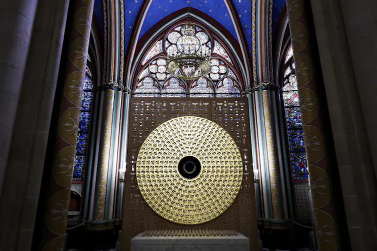 A large gold circle with a blue circle in the middle.