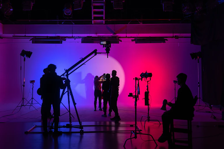 cast and crew on a indoor film set