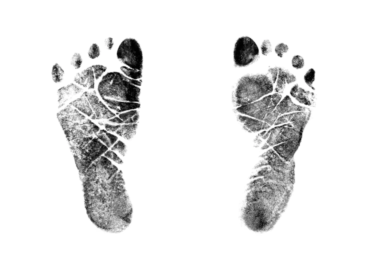 Authentic Inked stamped impressions of a newborns' feet isolated on a 100% white background.