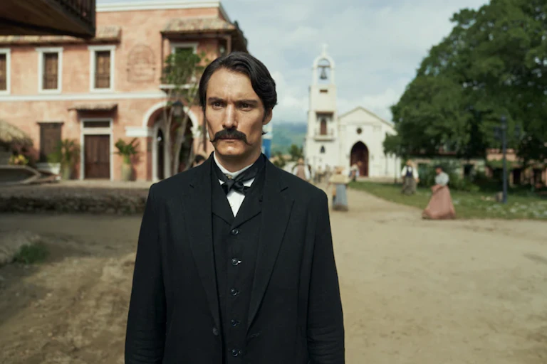A man with a big moustache dressed in mid 19th-century attire.