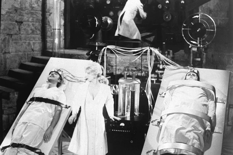 eri Garr, center,is shown during an operation, exchanging the bodily organs of young Dr. Frankenstein, played by Gene Wilder, left, and the monster, played by Peter Boyle.