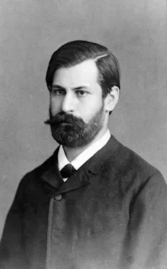 A bearded, dark-haired, young Sigmund Freud.