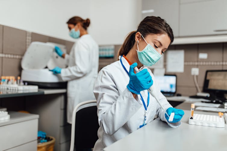 Two women working in a lab.