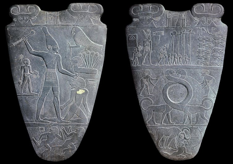 Two stone tablets with hieroglyphs.