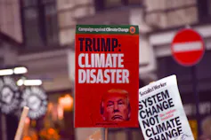 Protest with 2 placards visible -
