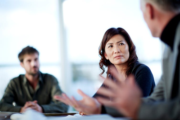 Woman looking concerned in meeting