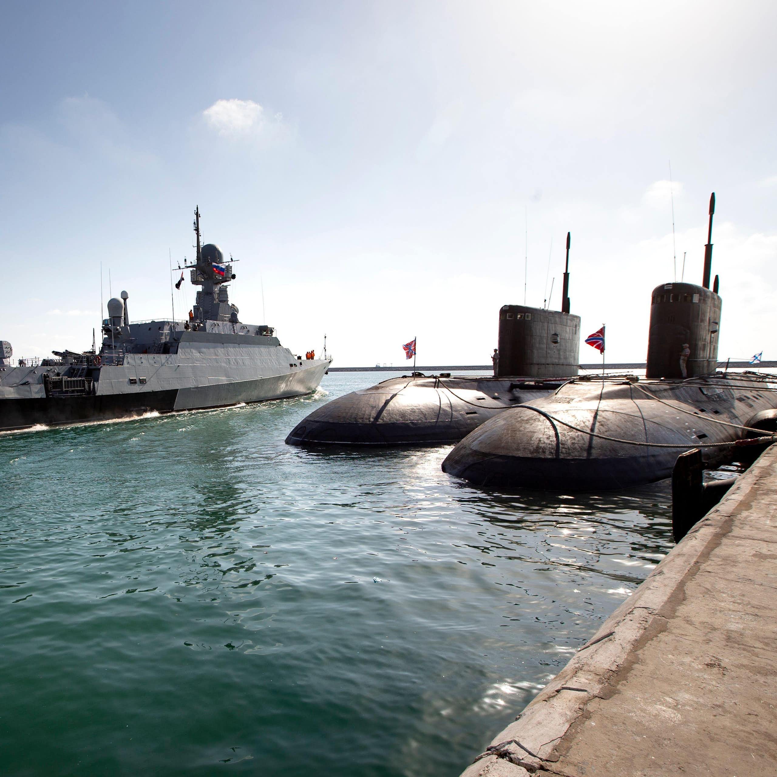 Two Russian mini-subs sit at anchor as a Russian missile ship sails out of Tartus naval base in Syria, September 2019.