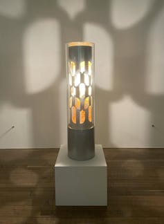 silver plinth casting light