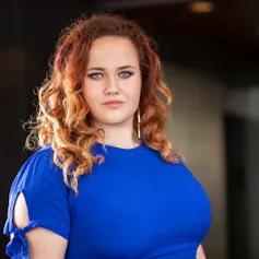 Rachel Thomas in a blue dress.