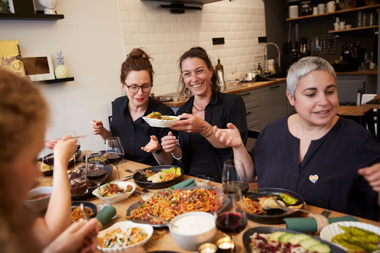 A group of people seated around a table for a meal