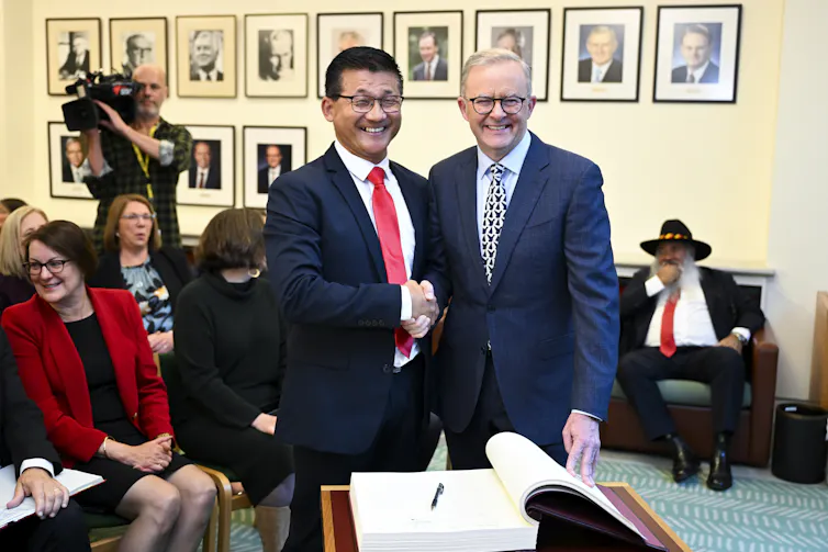 Sam Lim, shaking hands with Anthony Albanese