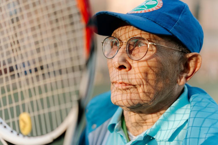 Man with tennis racket