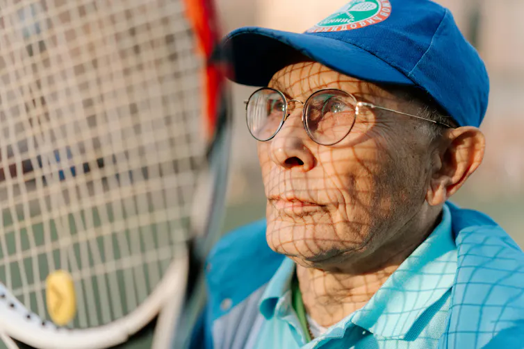 Man with tennis racket