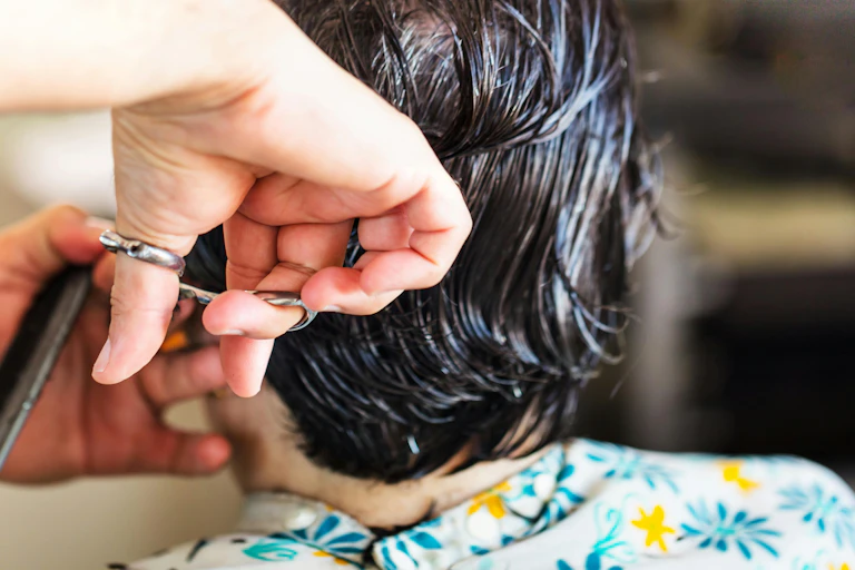 Person cuts hair
