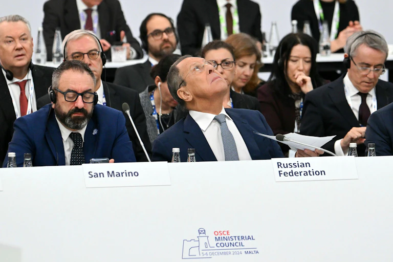 Russian foreign minister, Sergei Lavrov, looks at the ceiling during a meeting of the OSCE ministerial council.