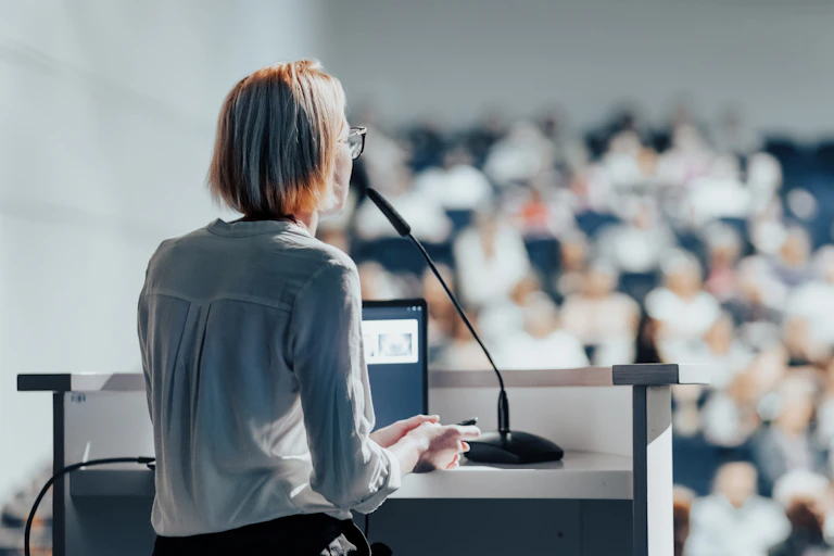 Woman giving a lecture.