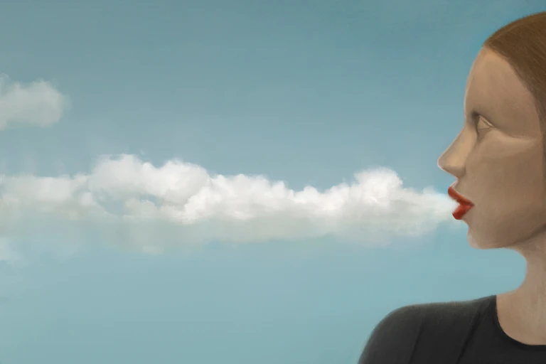 Una mujer sopla y de su boca salen nubes.