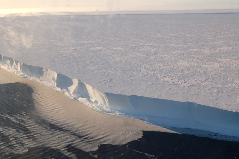 Aerial photo of the edge of an ice shelf.