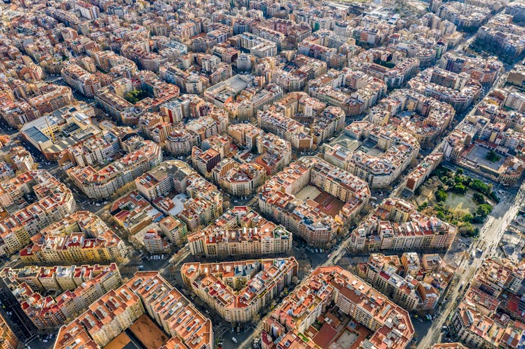Aerial photo showing a grid of square apartment buildings.