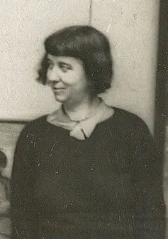 A woman with a short, dark bob.