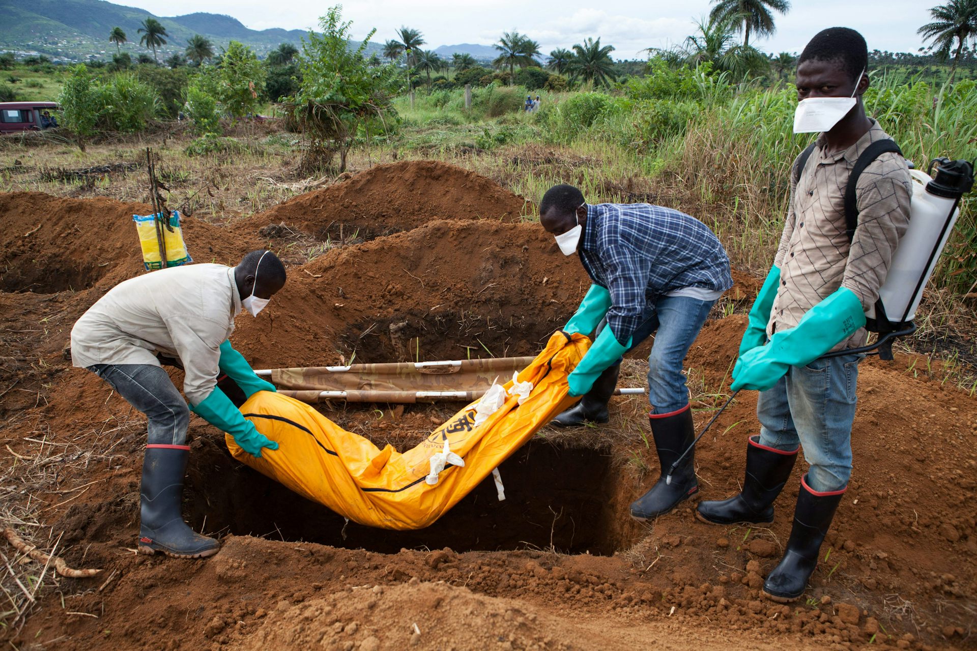 Men burying Ebola victim