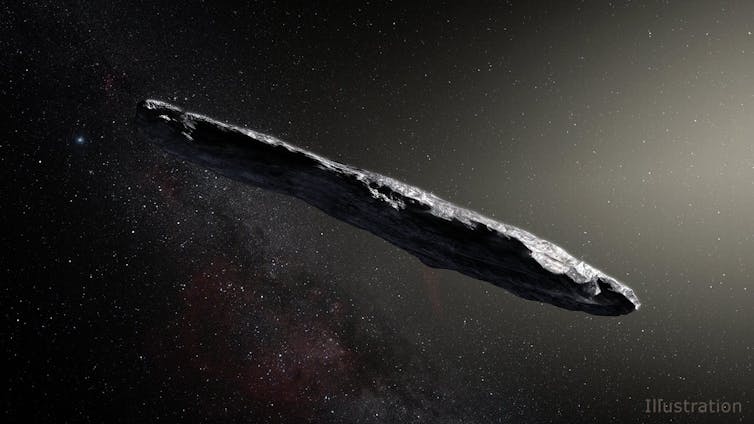 An elongated rock partially lit by the sun on a dark background.
