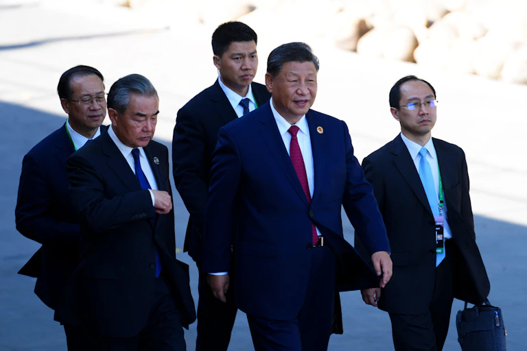 President Xi in a group of men with suits.