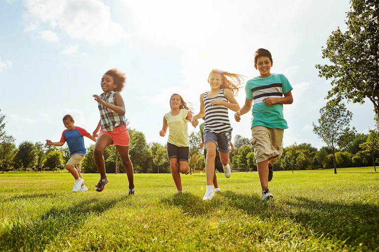 A group of children running.