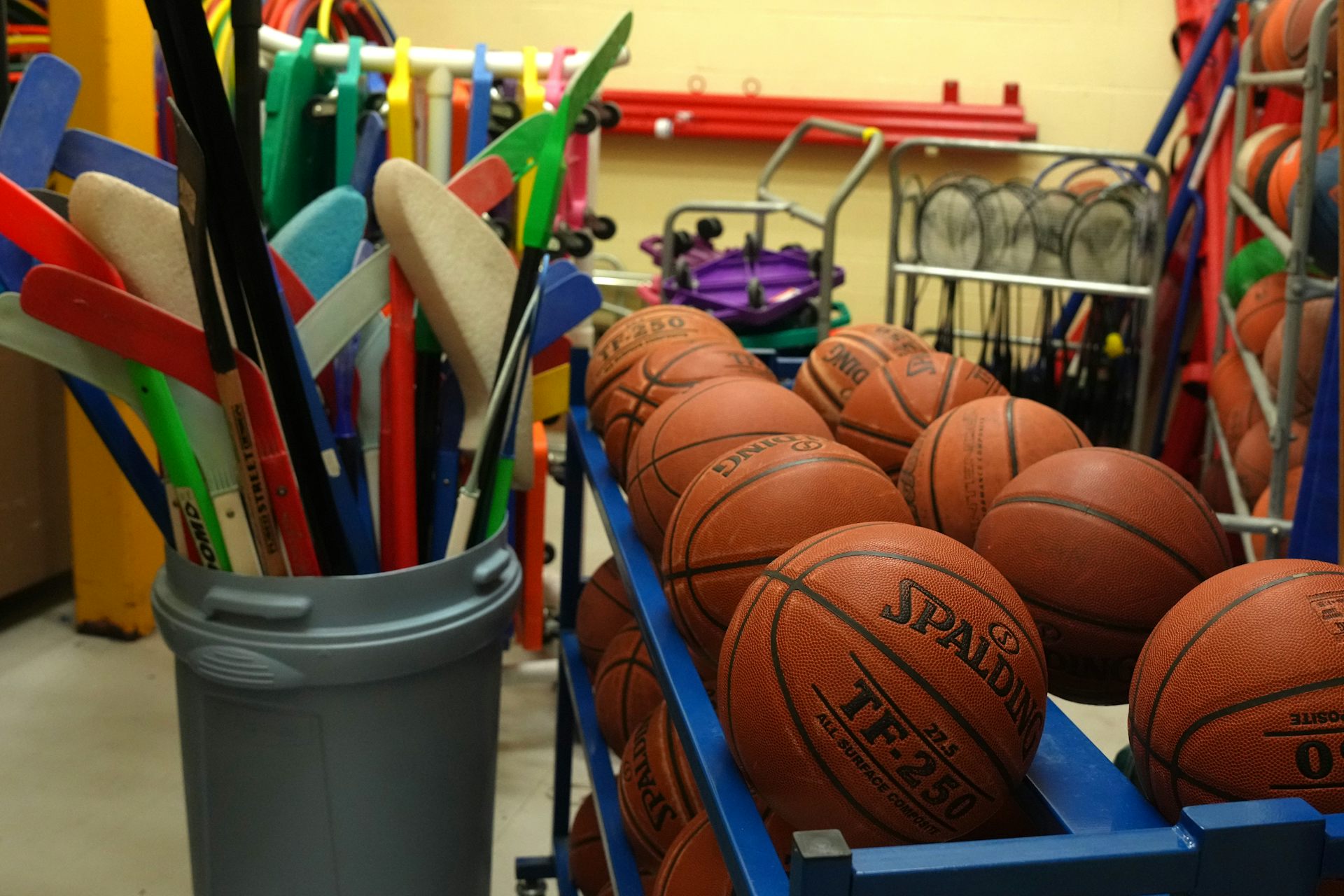Floor hockey sticks, basketballs and other sports equipment.