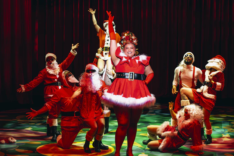 The cast in Santa costumes