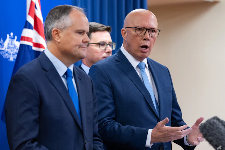 Opposition Leader Peter Dutton speaks to media with Energy spokesman Ted O'Brien by his right hand side and Nationals Leader David Littleproud in the background, Brisbane, Friday, December 13, 2024