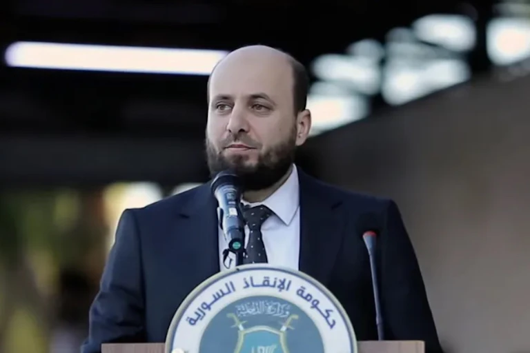 Mohammed al-Bashir speaking at a press conference.