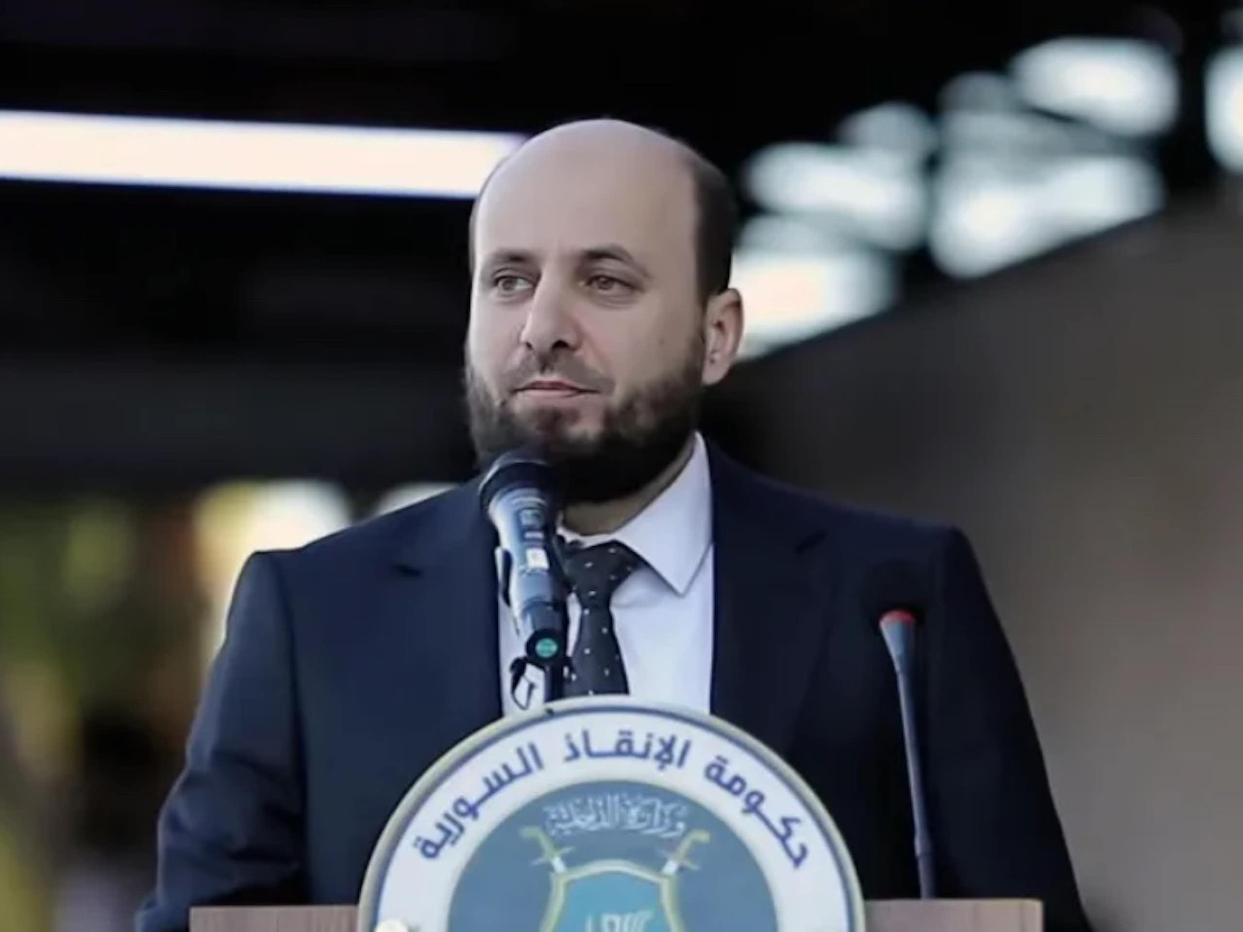 Mohammed al-Bashir speaking at a press conference.