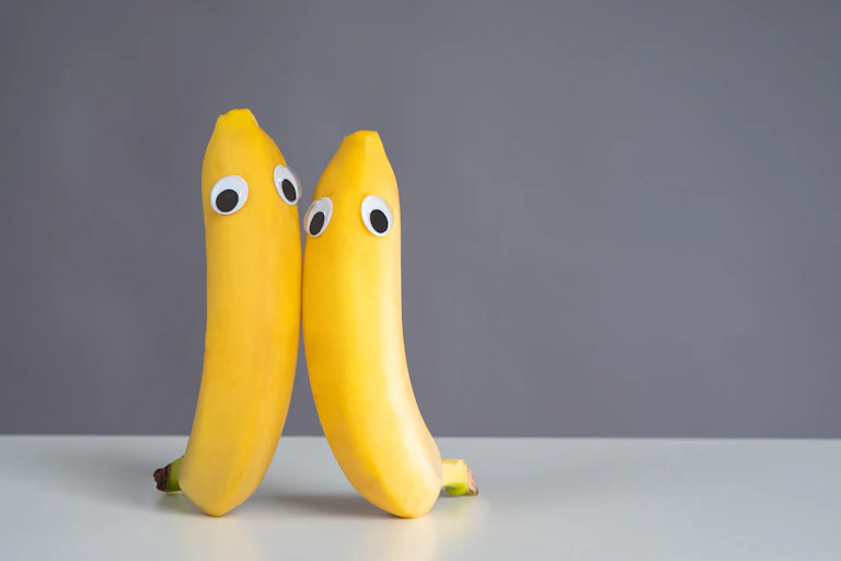 Two bananas with googly eyes stuck on.