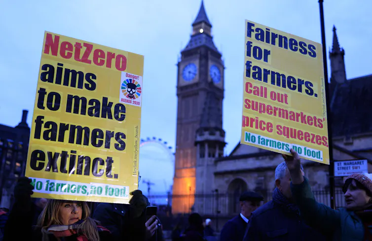 'Net zero aims to make farmers extinct' placard at protest