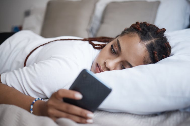 Woman scrolling on her phone